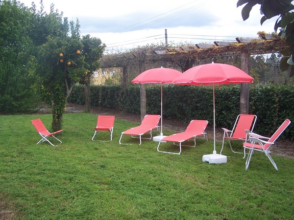 Sunloungers and other garden chairs and umbrellas are provided