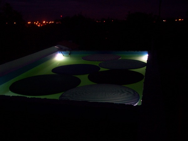 The pool lit at night